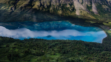 Blue Reflections - Blue Reflections.  Portage Lake reflecting the surrounding mountains in Lake Clark National Park in Alaska.