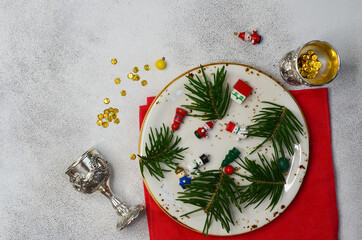 table decoration for christmas ceramic plate silver cutlery christmas tree branch with copy space for text or design