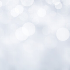 White bokeh lights defocused. glitter abstract background