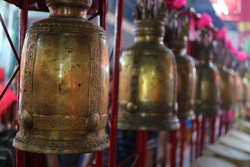 Fototapeta na wymiar buddhist prayer wheels in the temple