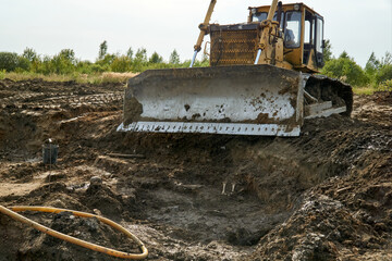 Excavator at mass grave archaeological site