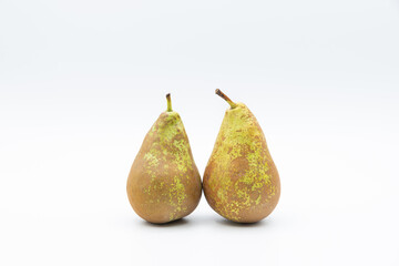 Two green and yellow pears placed in the center isolated with white background and plenty of copy space.