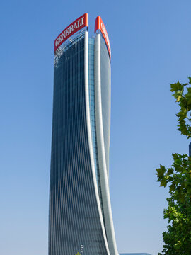 Milano, Italy. The iconic Generali tower at CityLife district designed by Zaha Hadid. Skyscraper which is part of a group of residential and business buildings. Modern buildings