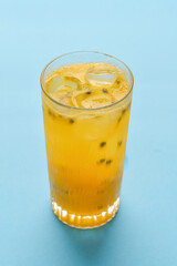 Chia seeds lemonade. Refreshing summer beverage in a glass. Yellow drink with ice.