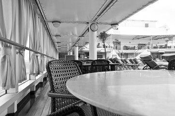 Casual outdoor pool grill restaurant for snacks in bistro style onboard luxury cruiseship or cruise...