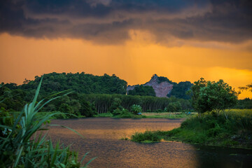 sunset over the lake,beautiful scenery of Phatthalung,Thailand,Traveling destination,Agricultural field with sunn hemp. 