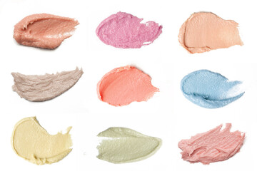 Cosmetics and makeup samples on white background