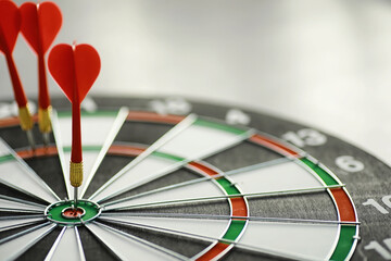 Fototapeta premium Darts. The dart for playing in the game board is stuck. Hit the sector in darts. The concept of a successful strategy.
