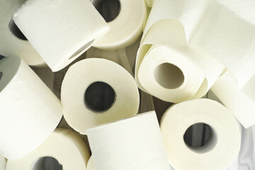 Toilet paper in a roll. Snow-white soft three-layer toilet paper. Lack of hygiene products. Primary protection and disinfection.