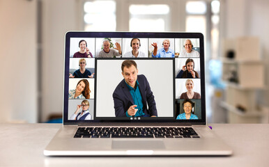 Multiethnic business team having discussion in video call. Rear view of business woman in video conference with boss and his colleagues during online meeting. Senior woman in video call with partners.