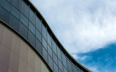 Fototapeta na wymiar modern building with clouds sky