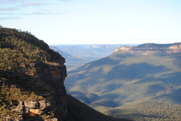 Fototapeta na wymiar The cliffs and the hiking trails in the Blue Mountains national park in Australia on the sunny winter day