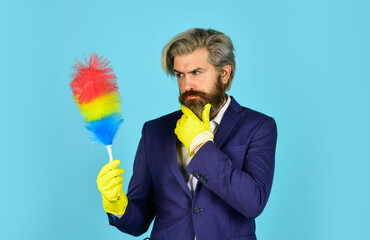 Office duster. Man use pp duster. Dust allergy. Businessman cleaning office. Cleaning service. Housekeeping duties. Cleaning apartment. Clear reputation. Hipster hold cleaning tool. Cleaning concept