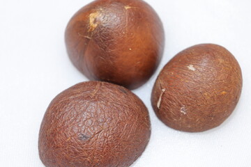 Close up view of dried coconut chips on white background in india
