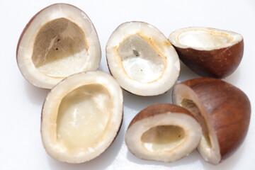 Close up view of dried coconut chips on white background in india