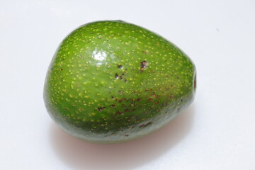 fresh avocado isolated on white background closeup