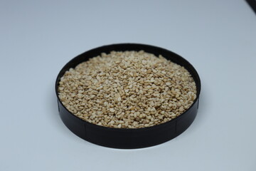 Organic natural Til Gul OR Sesame seeds over white background