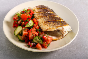 Served healthy dinner, salad and fried white fish