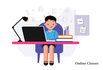 Boy is studying with laptop at home