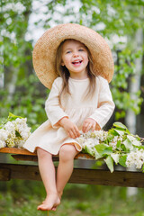 portrait of little girl outdoors in summer