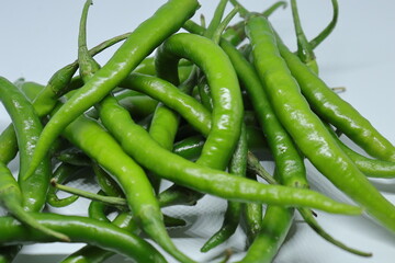 Green cayenne pepper with a white background