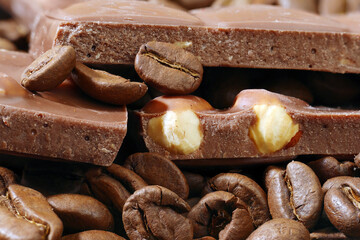 stack of milk chocolate pieces and coffee beans