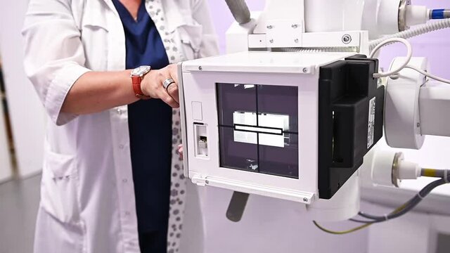 Medical active light X-ray machine operating in a hospital clinical lab, low angle shot