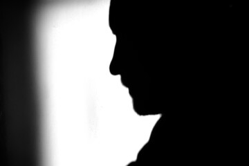 contrasting shadow of a man on the wall