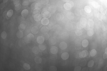 Abstract bokeh christmas lights texture on black background.