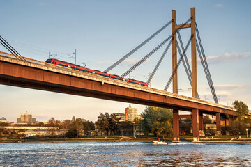 A passenger train crossing the bridge