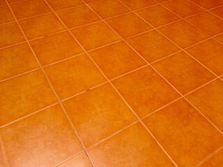 Orange ceramic tile floor