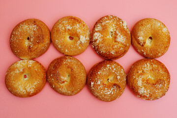 cookies on pink background, flat lay, closeup