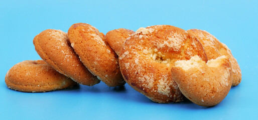 closeup of cookies in a row on blue background