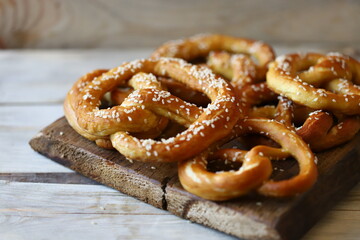 Fresh pretzels on a wooden surface. Preparing for Oktoberfest.