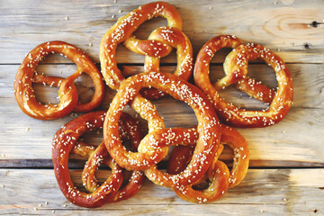 Fresh pretzels on a wooden surface. Preparing for Oktoberfest.