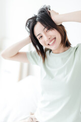 Naklejka premium Asian women playing in the bedroom