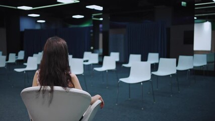 speaker waiting audience in empty conference hall for presentation or lecture