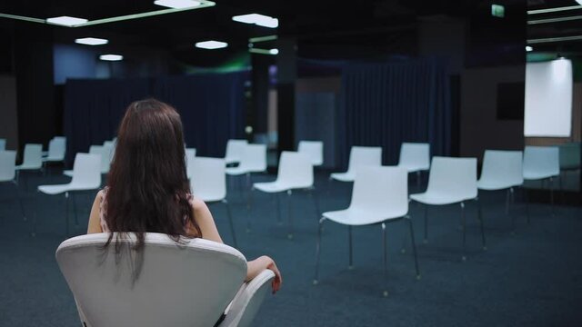 speaker waiting audience in empty conference hall for presentation or lecture