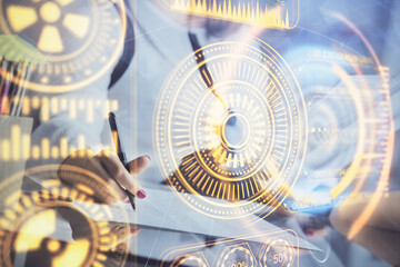 Technology theme hologram over woman's hands taking notes background. Concept of Tech. Double exposure
