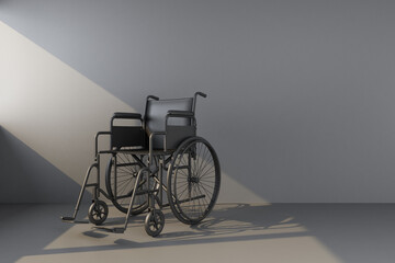 black wheelchair in beam of light