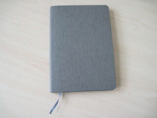 silver notebook on a wooden background