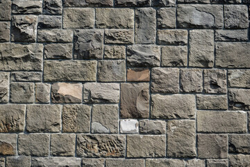 Background: Natural stone wall tiles on a wall
