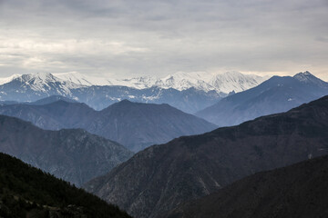 Range of mountains seen from above with clouds