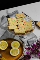 Lemon cakes placed on a glass plate. Delicious dessert arrangement