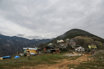 Village houses by the rocky mountains