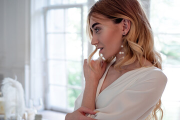 Beautiful elegant bride in a simple white wedding dress