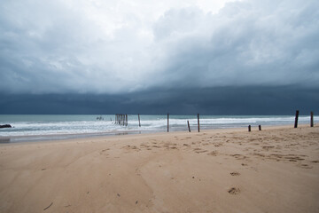 Shelf cloud or arcus of a severe thunderstorm over beach 