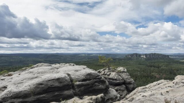 Timelapse - Moving clouds over the Elbe Sandstone mountains as seen from the table mountain Gohrisch, Saxony, Germany