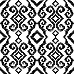 Ikat. Abstract ethnic pattern on fabric in Indonesia and other Asian countries. Seamless background. Vector illustration for web design or print.