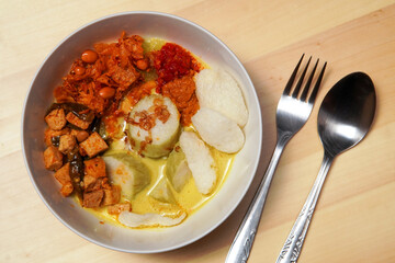 Lontong Sayur Medan. Vegetarian dish of rice cake and vegetable curry soup from Medan, North Sumatra, Indonesia.